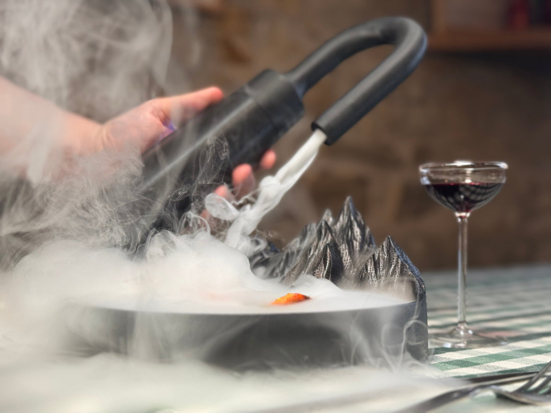MIST edible fog generator placed on restaurant table setting